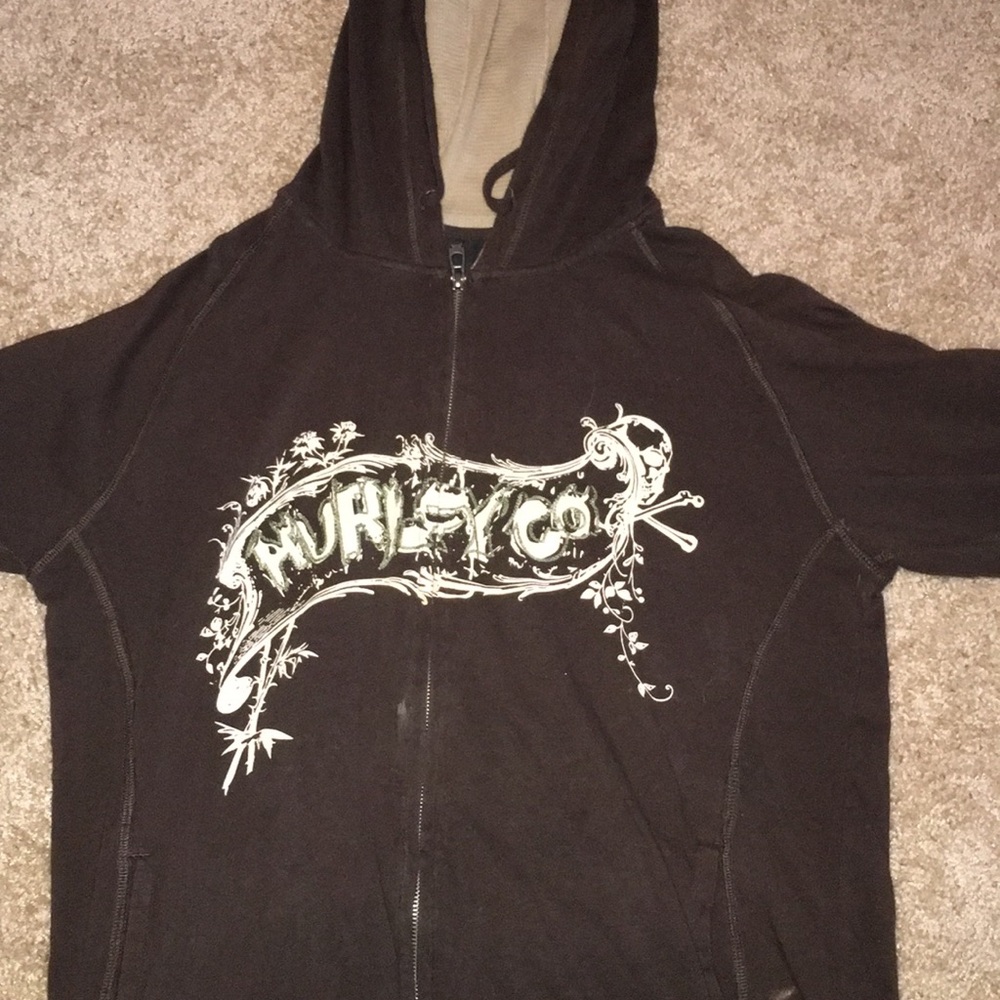 Brown Hurley zip-up jacket.